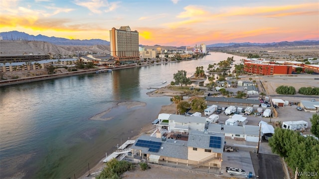 property view of water with a mountain view and a city view