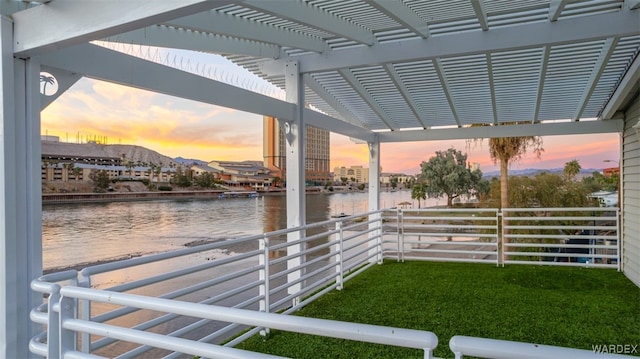 view of dock with a water view and a pergola