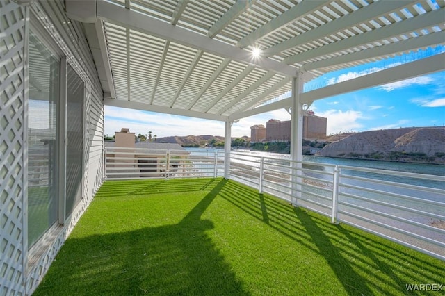 view of yard featuring a pergola and a water and mountain view