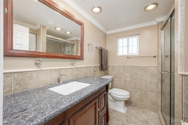 bathroom featuring crown molding, tile walls, toilet, vanity, and tiled shower