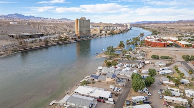 bird's eye view with a water and mountain view