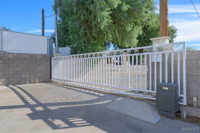 view of gate featuring fence