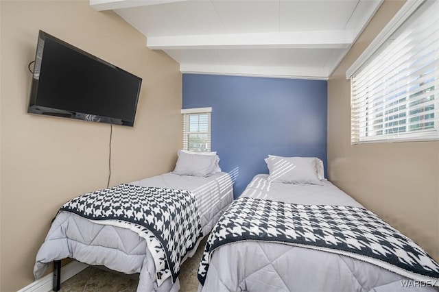 bedroom featuring beamed ceiling