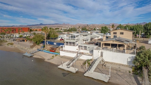 bird's eye view featuring a water and mountain view