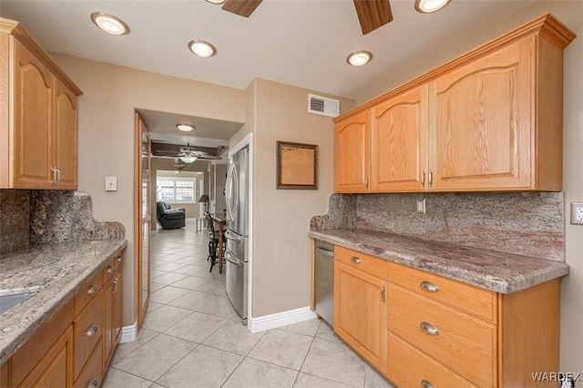 kitchen featuring ceiling fan, light tile patterned floors, stone countertops, visible vents, and appliances with stainless steel finishes