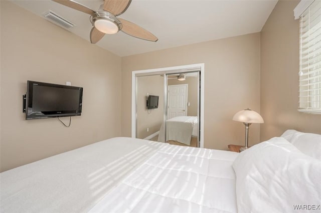 bedroom featuring ceiling fan and visible vents