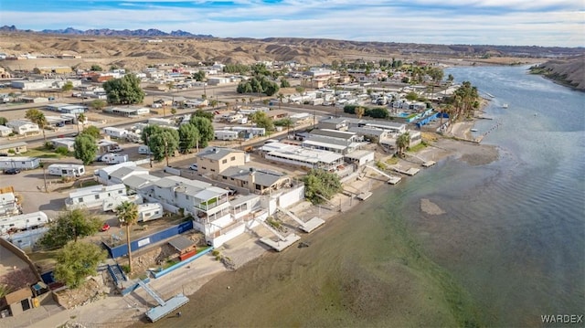 drone / aerial view with a water and mountain view