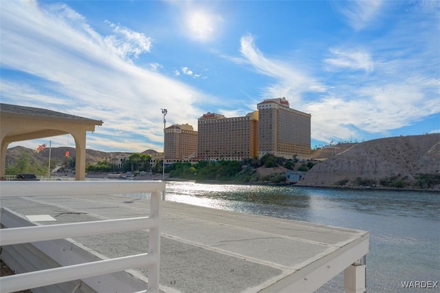 property view of water featuring a view of city and a mountain view