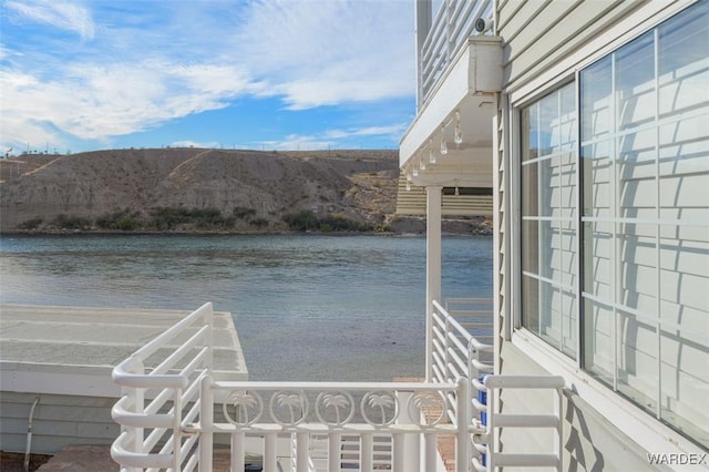 dock area featuring a water and mountain view