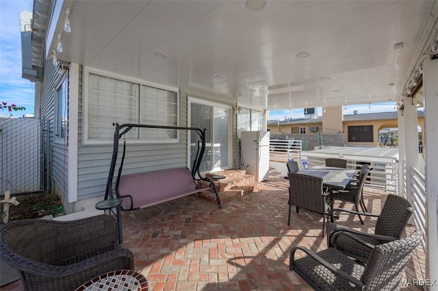 view of patio featuring outdoor dining area