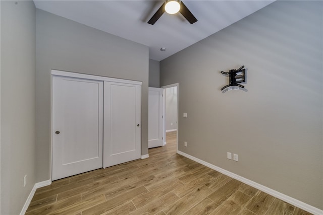 2339 E Calle Madrid, Fort Mohave, AZ 86426 - unfurnished bedroom featuring light wood-style flooring, baseboards, a closet, and ceiling fan