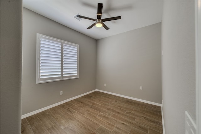2339 E Calle Madrid, Fort Mohave, AZ 86426 - empty room with a ceiling fan, wood finished floors, and baseboards