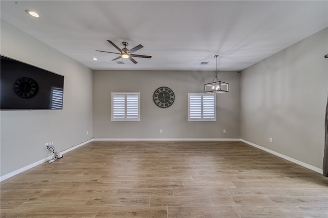2339 E Calle Madrid, Fort Mohave, AZ 86426 - unfurnished room with plenty of natural light, a chandelier, ceiling fan, recessed lighting, and light wood-style floors