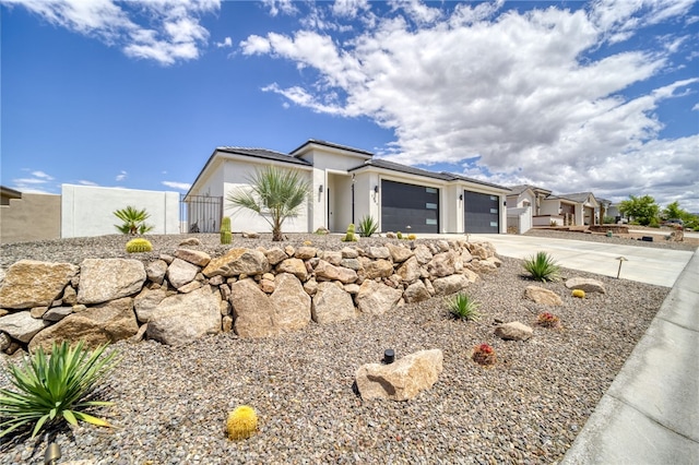 2339 E Calle Madrid, Fort Mohave, AZ 86426 - view of front facade with an attached garage, stucco siding, driveway, and fence