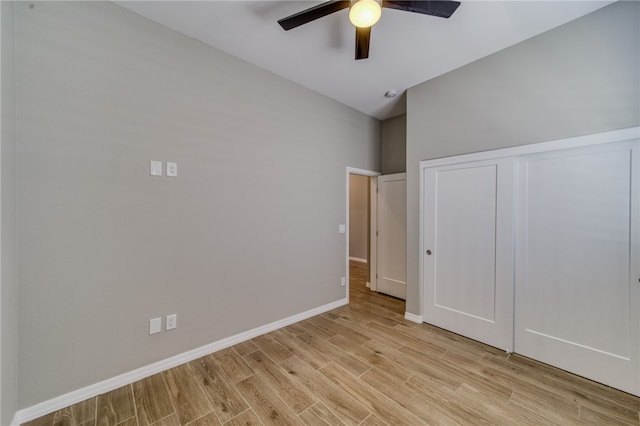 2339 E Calle Madrid, Fort Mohave, AZ 86426 - unfurnished bedroom featuring light wood finished floors, a closet, baseboards, and ceiling fan