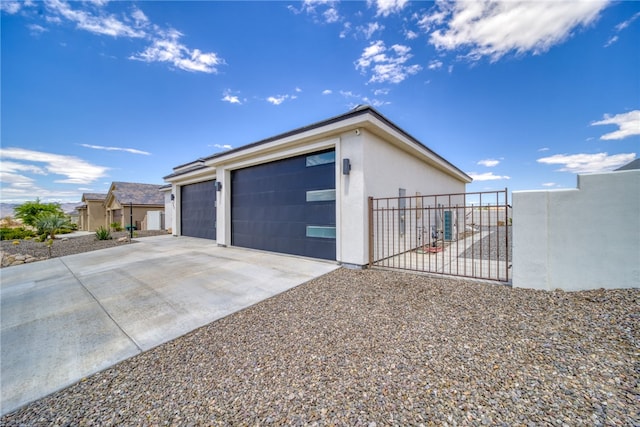 2339 E Calle Madrid, Fort Mohave, AZ 86426 - garage with fence, a gate, and driveway