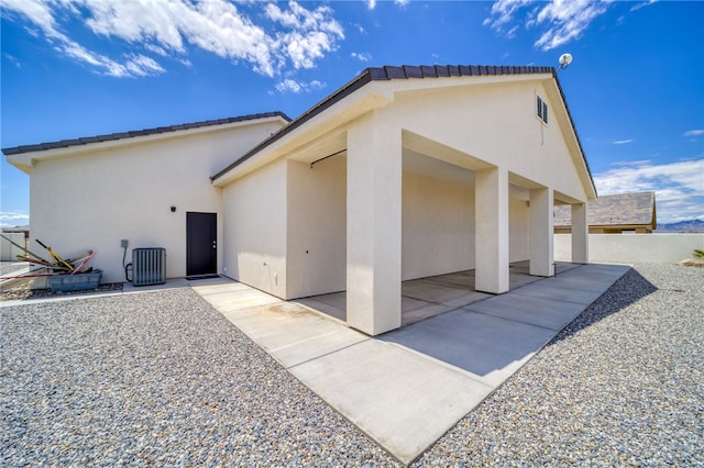 2339 E Calle Madrid, Fort Mohave, AZ 86426 - view of side of home with stucco siding and a patio area