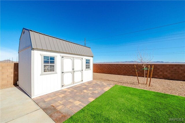 view of shed featuring a fenced backyard