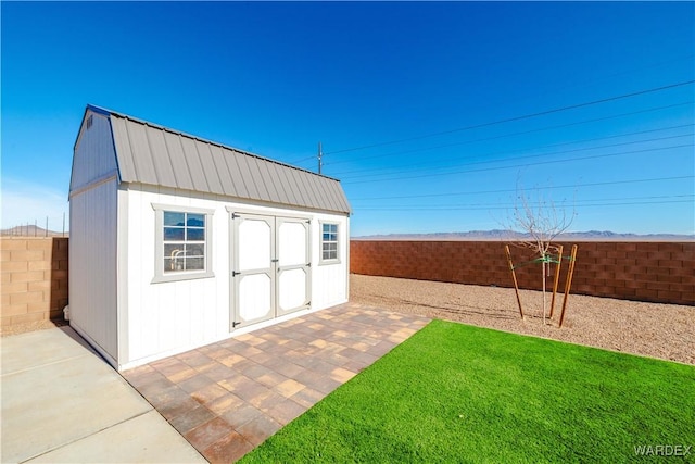 view of shed with a fenced backyard