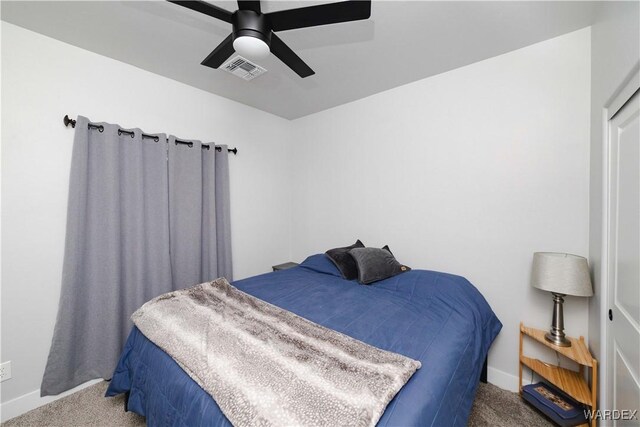 bedroom featuring ceiling fan, carpet floors, visible vents, and baseboards