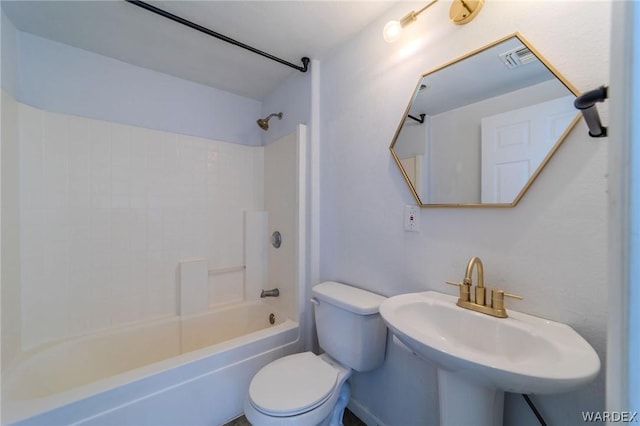 full bathroom featuring toilet, a sink, and shower / bathing tub combination