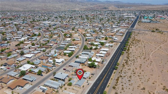 drone / aerial view featuring a residential view and a mountain view