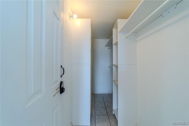 walk in closet featuring light tile patterned floors