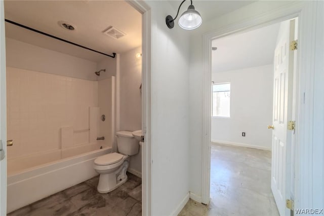 bathroom featuring toilet, tub / shower combination, visible vents, and baseboards