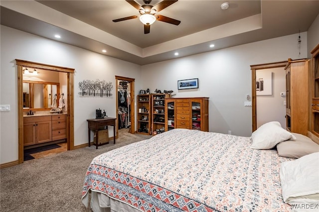 bedroom featuring recessed lighting, a closet, a walk in closet, carpet, and ensuite bathroom