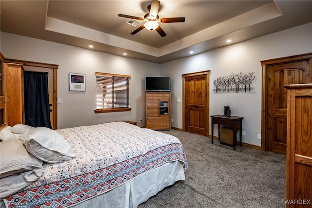 bedroom featuring recessed lighting, carpet floors, baseboards, visible vents, and a raised ceiling