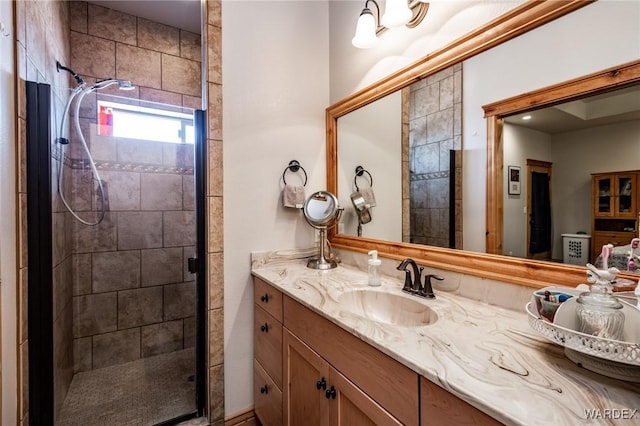 bathroom with vanity and a stall shower