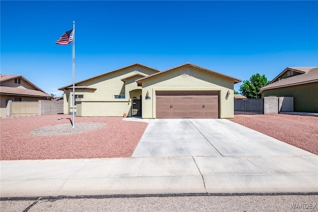 ranch-style home with driveway, a garage, stucco siding, and fence