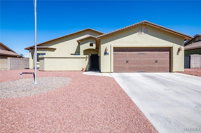 single story home with a garage, fence, stucco siding, and concrete driveway