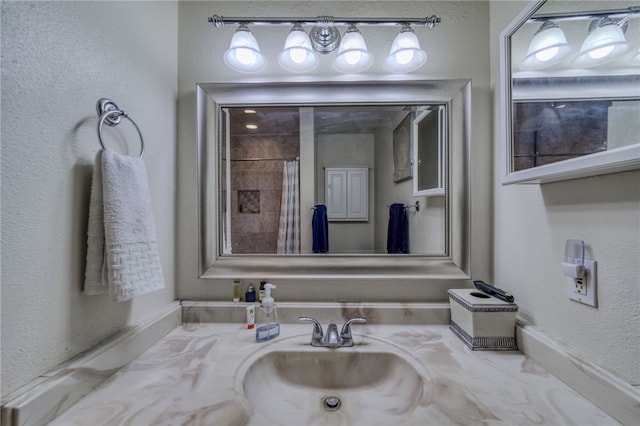3408 Sunriver Rd Unit 207 B6, Bullhead City, AZ 86429 - full bathroom featuring vanity, a textured wall, and a shower with shower curtain