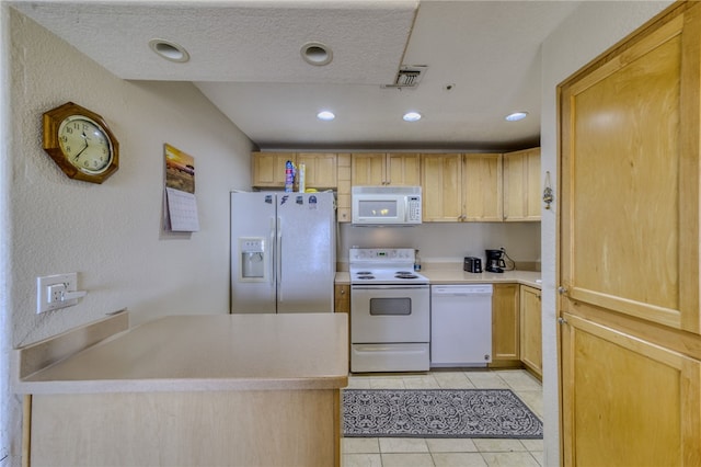 3408 Sunriver Rd Unit 207 B6, Bullhead City, AZ 86429 - kitchen with white appliances, light tile patterned flooring, recessed lighting, light brown cabinets, and light countertops