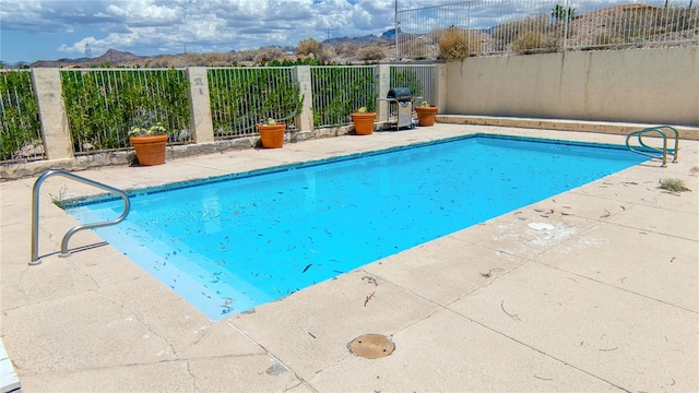 3408 Sunriver Rd Unit 207 B6, Bullhead City, AZ 86429 - view of pool featuring a grill and a patio