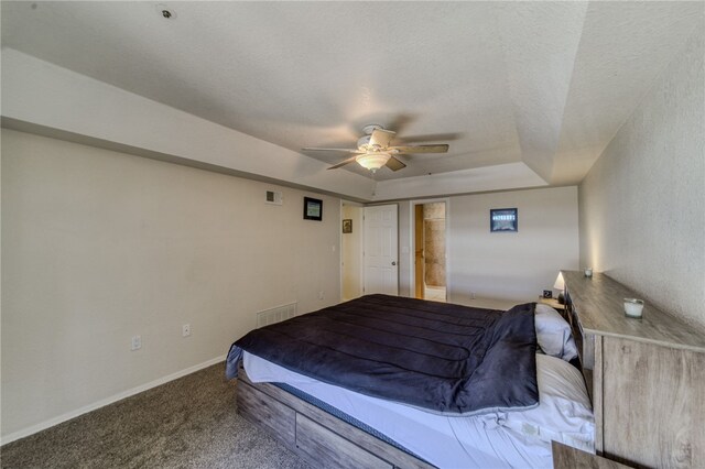 3408 Sunriver Rd Unit 207 B6, Bullhead City, AZ 86429 - bedroom featuring carpet floors, a raised ceiling, baseboards, a ceiling fan, and a textured ceiling