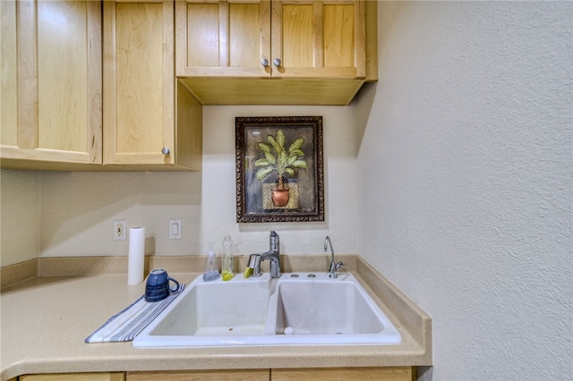 3408 Sunriver Rd Unit 207 B6, Bullhead City, AZ 86429 - kitchen featuring a sink, light brown cabinetry, a textured wall, and light countertops