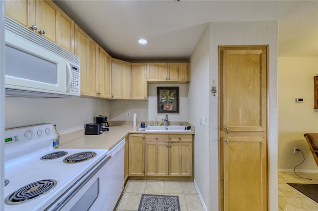 3408 Sunriver Rd Unit 207 B6, Bullhead City, AZ 86429 - kitchen featuring white appliances, light tile patterned floors, light countertops, a sink, and light brown cabinets