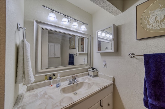 3408 Sunriver Rd Unit 207 B6, Bullhead City, AZ 86429 - bathroom featuring vanity and a textured wall