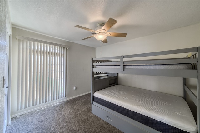 3408 Sunriver Rd Unit 207 B6, Bullhead City, AZ 86429 - unfurnished bedroom with carpet, baseboards, ceiling fan, and a textured ceiling