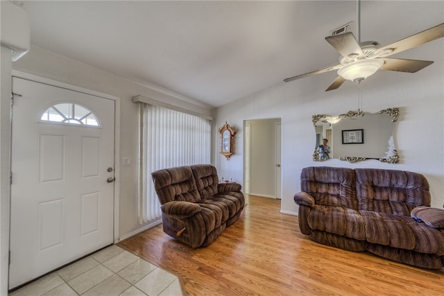 3408 Sunriver Rd Unit 207 B6, Bullhead City, AZ 86429 - living room with ceiling fan, lofted ceiling, light tile patterned floors, and baseboards