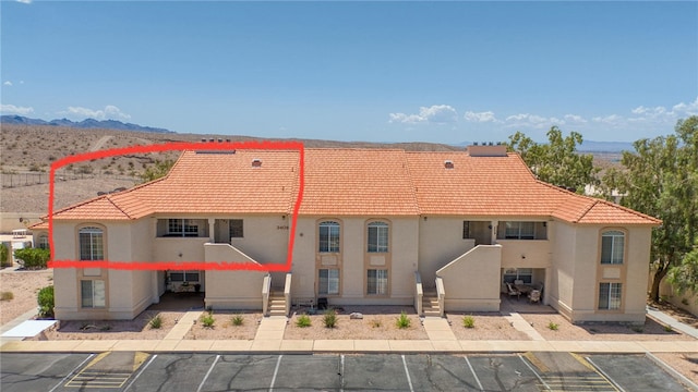 3408 Sunriver Rd Unit 207 B6, Bullhead City, AZ 86429 - view of building exterior featuring uncovered parking and a mountain view