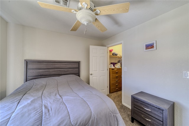 3408 Sunriver Rd Unit 207 B6, Bullhead City, AZ 86429 - carpeted bedroom with a walk in closet and a ceiling fan