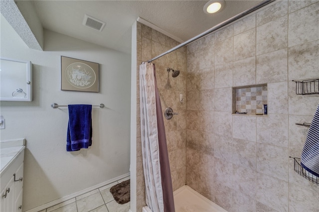 3408 Sunriver Rd Unit 207 B6, Bullhead City, AZ 86429 - full bath featuring vanity, tiled shower, tile patterned flooring, and baseboards