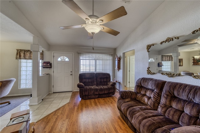 3408 Sunriver Rd Unit 207 B6, Bullhead City, AZ 86429 - living room featuring lofted ceiling, ceiling fan, ornate columns, and light tile patterned floors