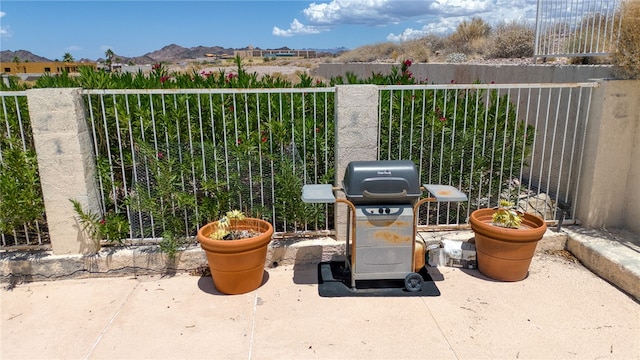 3408 Sunriver Rd Unit 207 B6, Bullhead City, AZ 86429 - view of patio / terrace featuring a grill and a mountain view