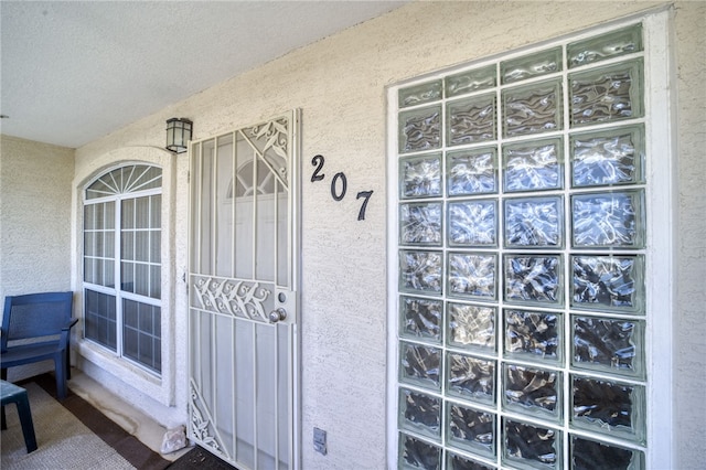 3408 Sunriver Rd Unit 207 B6, Bullhead City, AZ 86429 - entrance to property with stucco siding and a porch