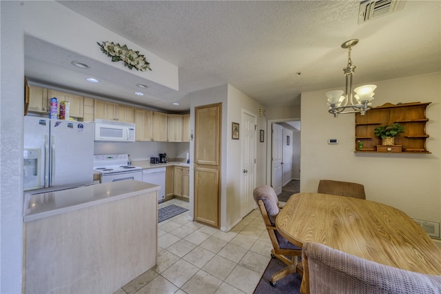 3408 Sunriver Rd Unit 207 B6, Bullhead City, AZ 86429 - kitchen with white appliances, light countertops, a chandelier, pendant lighting, and a textured ceiling