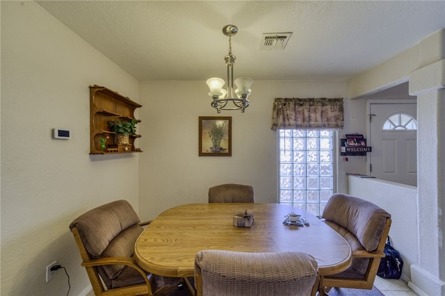 3408 Sunriver Rd Unit 207 B6, Bullhead City, AZ 86429 - dining space featuring a chandelier and baseboards